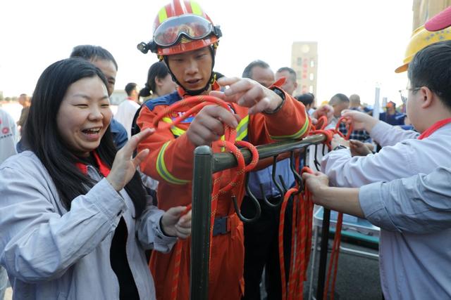  119 Fire publicity month, knots, firemen, factory employees